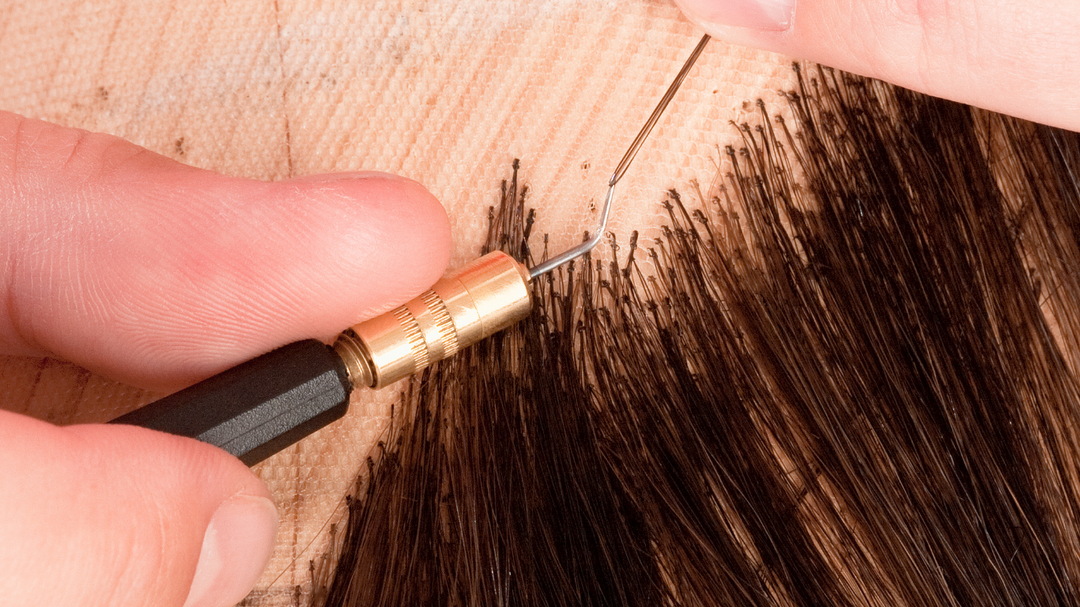 Sewing black hair into lace